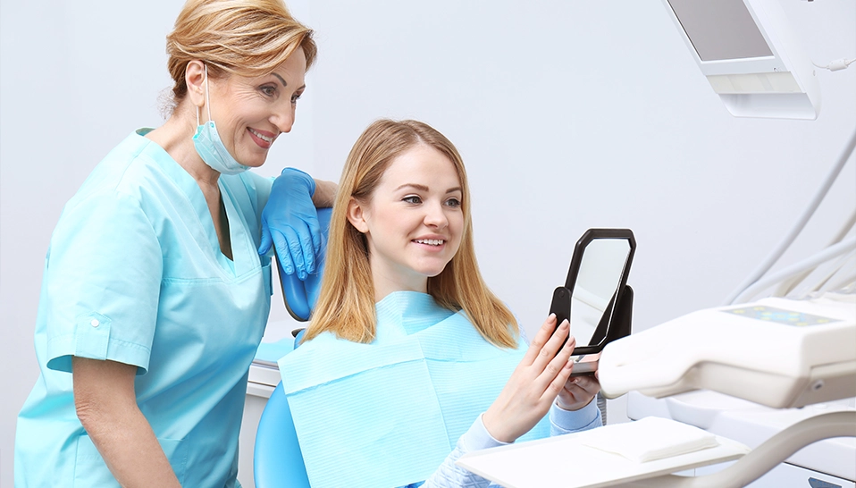 Smile Makeover woman checking on mirror